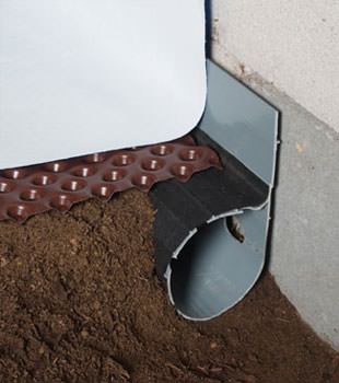 Closeup of a crawl space drainage system installed in Tahoe City