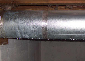condensation collecting on an HVAC vent in a humid Carnelian Bay basement